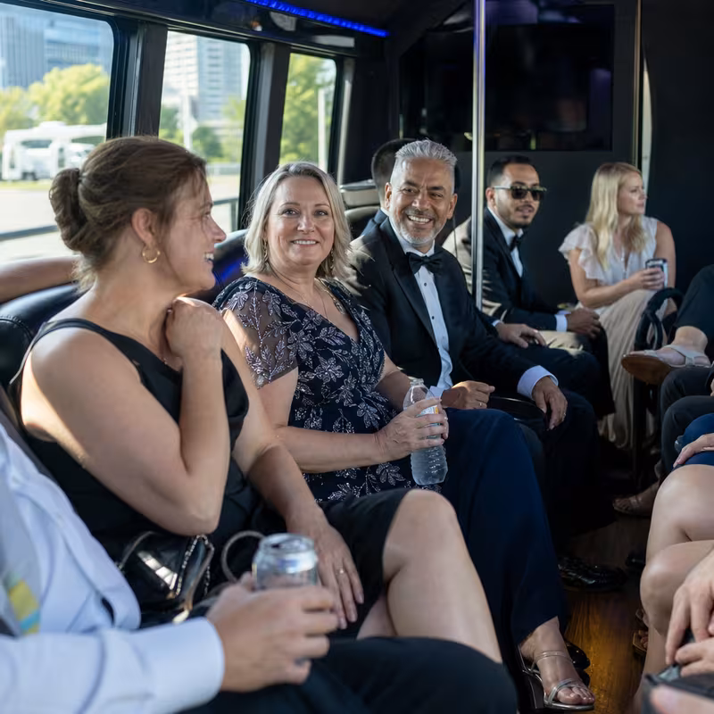 Wedding guests seated inside a Cincinnati party bus