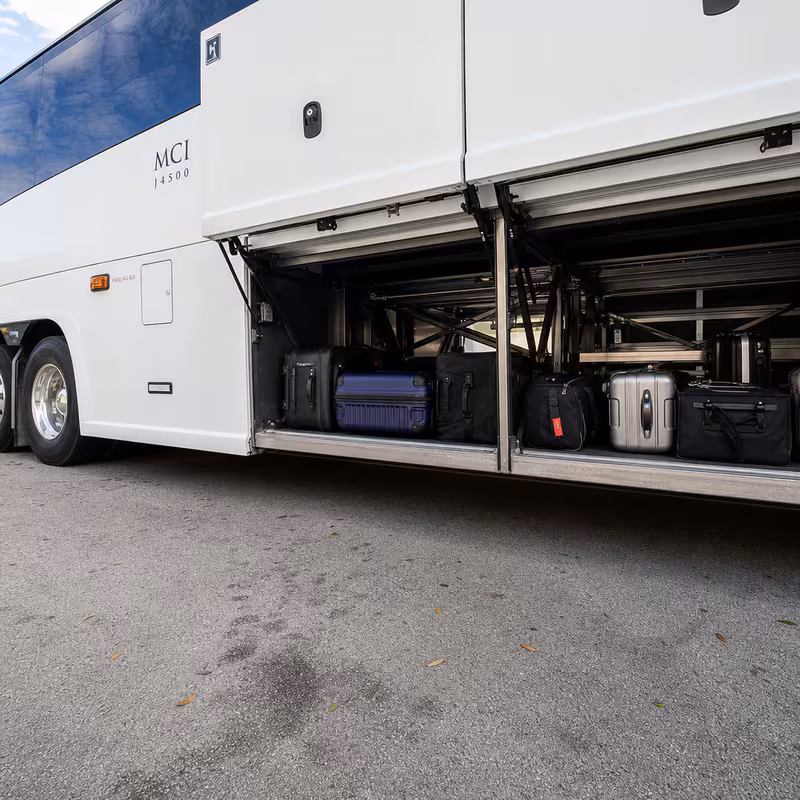 Party bus interior with wraparound leather seating and LED lighting in Cincinnati