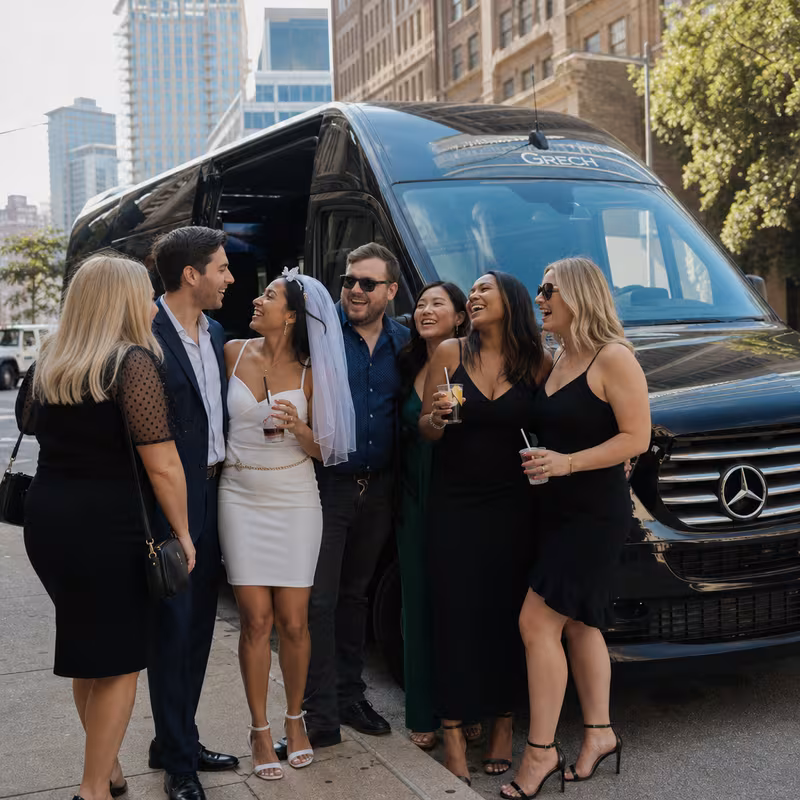 Group boarding a white charter bus for Bachelor & Bachelorette Transportation transportation in Cincinnati