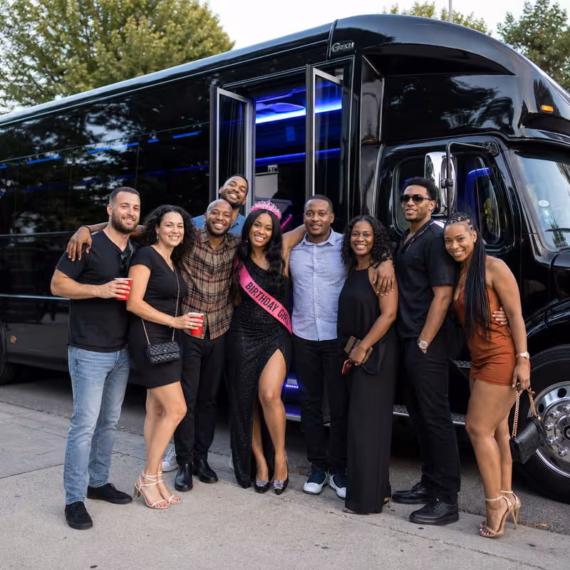 Group boarding a white charter bus for Birthday Transportation transportation in Cincinnati