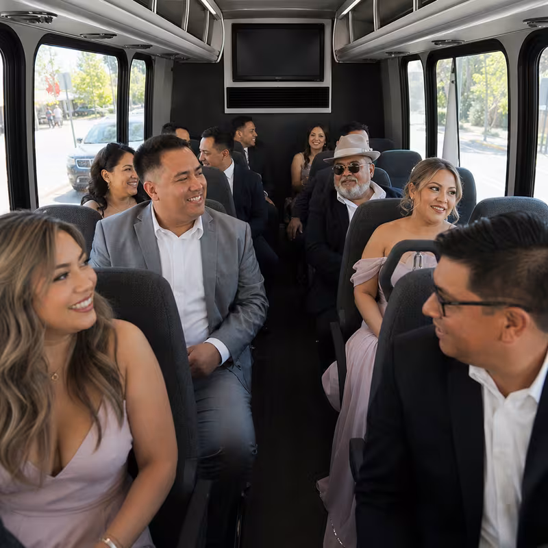 Group boarding a white charter bus for Private Event Transportation transportation in Cincinnati