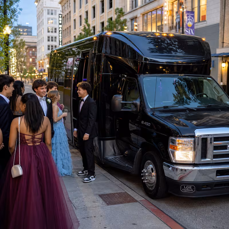 Passengers loading luggage while boarding an Cincinnati group shuttle
