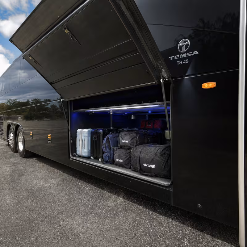 Party bus interior with wraparound leather seating and LED lighting in Cincinnati