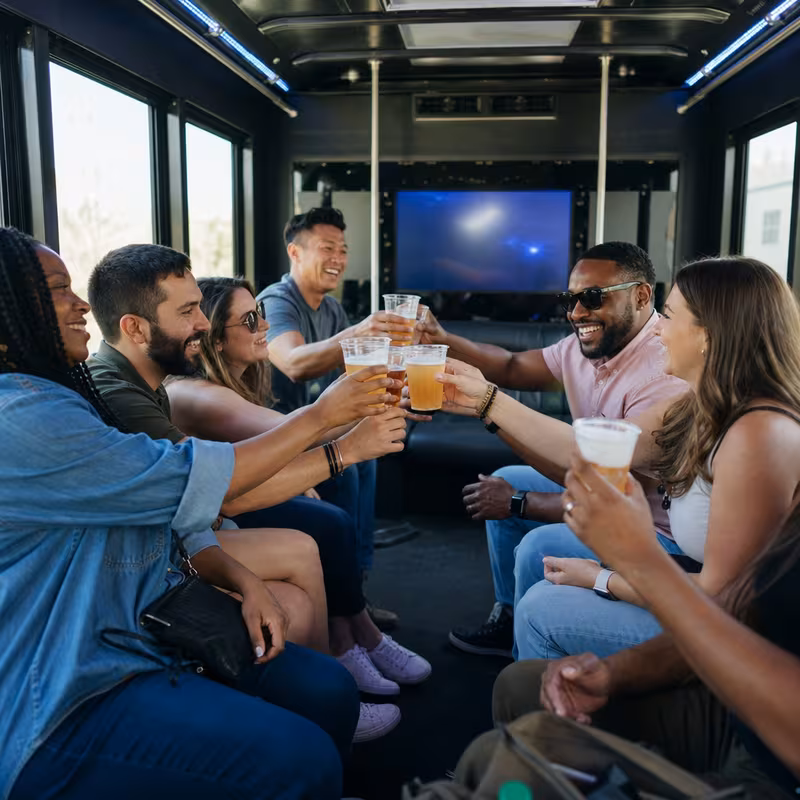 Group boarding a white charter bus for Winery & Brewery Tour Transportation transportation in Cincinnati