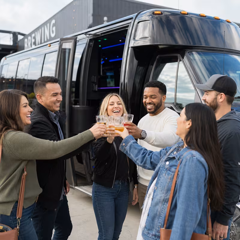 Passengers loading luggage while boarding an Cincinnati group shuttle